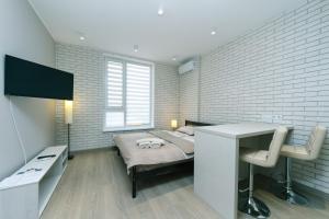 Televízia a/alebo spoločenská miestnosť v ubytovaní Comfort Town apartment