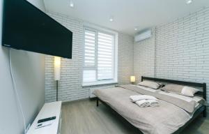 Televízia a/alebo spoločenská miestnosť v ubytovaní Comfort Town apartment