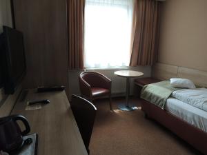 A television and/or entertainment centre at Hotel Club