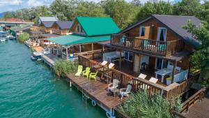 an aerial view of a house on the water at Hakuna Matata Apartments in Ulcinj