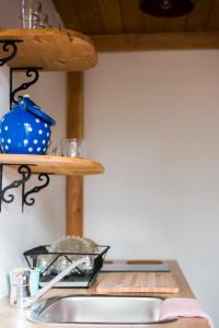 a kitchen counter with a sink and a shelf at Nature nook in Bled +13 photos