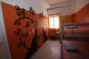 Postel nebo postele na pokoji v ubytování Sunflower Beach Backpacker Hostel & Bar