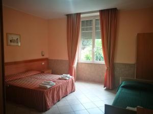 Postel nebo postele na pokoji v ubytování Palma Residences In Rome