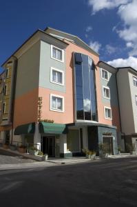 a building on the side of a street at Hotel San Michele in LʼAquila