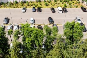 an aerial view of a parking lot with cars at Hotel Da Vinci in Milan