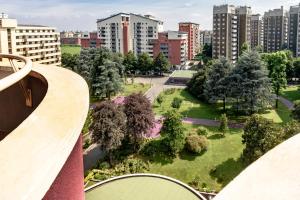 a view of a park in a city with tall buildings at Hotel Da Vinci in Milan