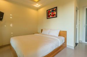 Cama o camas de una habitación en D Central Hoi An Homestay