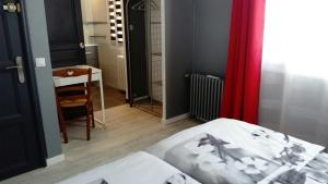 Postel nebo postele na pokoji v ubytování L'Hibiscus Chambre d'Hôte