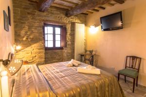 Postel nebo postele na pokoji v ubytování Valbuona b&b