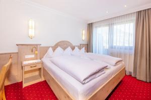 Posteľ alebo postele v izbe v ubytovaní Hotel Serles