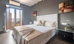 Ein Bett oder Betten in einem Zimmer der Unterkunft Circus House, TarracoHomes