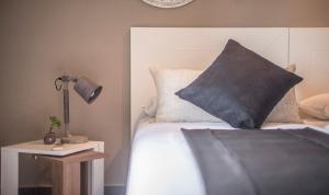 Ein Bett oder Betten in einem Zimmer der Unterkunft Circus House, TarracoHomes