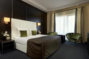 Ein Bett oder Betten in einem Zimmer der Unterkunft Van der Valk Resort Linstow