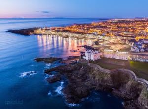 an aerial view of the city of dubrovnik at night at Suntana at Causeway Coast and Glens in Coleraine