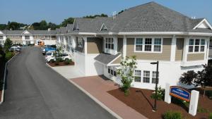 arial view of a house with a driveway at Howard Johnson by Wyndham Quincy/ Boston in Quincy
