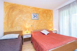 Postel nebo postele na pokoji v ubytování Apartment Ana