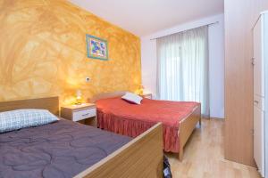 Postel nebo postele na pokoji v ubytování Apartment Ana