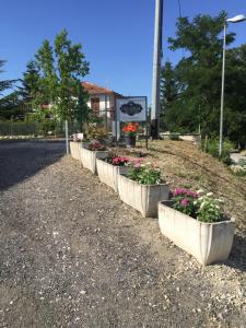 a row of flowerpots on the side of a road at B&B Casa Giorgia in Campobasso