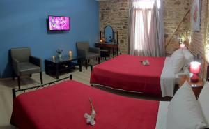 A bed or beds in a room at Ionia rooms