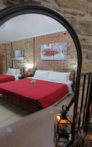 A bed or beds in a room at Ionia rooms