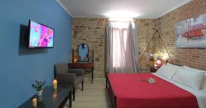 A bed or beds in a room at Ionia rooms