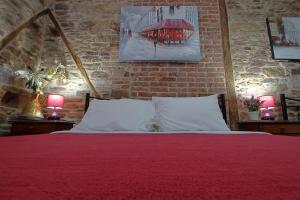A bed or beds in a room at Ionia rooms