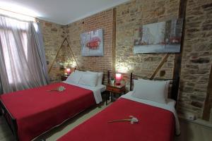 A bed or beds in a room at Ionia rooms