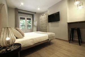 Cama o camas de una habitación en AbraCadabra Suites