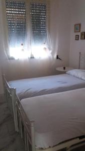 Le Querce Santa Cesarea Termeにあるベッド