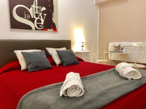 מיטה או מיטות בחדר ב-Lifestyle Veneto Suite