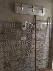 a bathroom with a shower with a tiled wall at El Rancho in Tarifa +14 photos