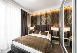Posteľ alebo postele v izbe v ubytovaní Elegancki Sopot