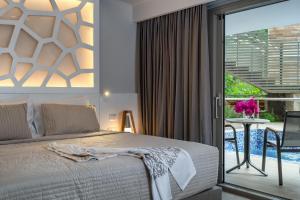 A bed or beds in a room at KB Ammos