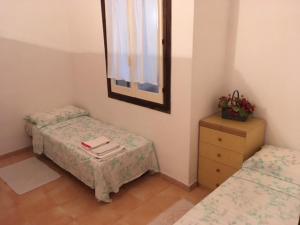 Krevet ili kreveti u jedinici u okviru objekta Villa Calaverde Santa Margherita di Pula