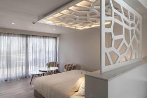 A bed or beds in a room at KB Ammos