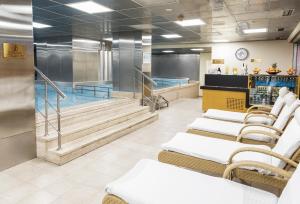 a waiting room with stairs and a swimming pool at Zorlu Grand Hotel Trabzon in Trabzon