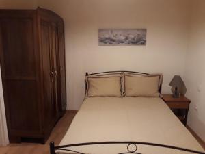 Postel nebo postele na pokoji v ubytování Atrium - Lafkos