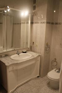 a bathroom with a sink and a toilet at Casa Miguel in La Portellada