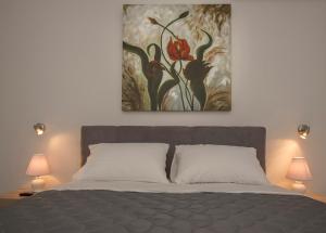 A bed or beds in a room at Acropolis Gem by GHH