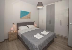 A bed or beds in a room at Acropolis Gem by GHH