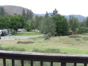 a view of a park from a porch at Winthrop Mountain View Chalets in Winthrop