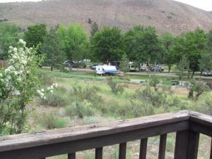 a view of a park with a rv in a field at Winthrop Mountain View Chalets in Winthrop
