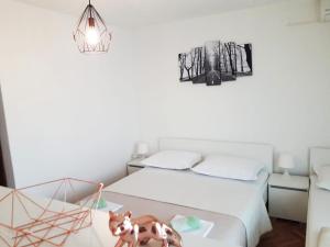 Postel nebo postele na pokoji v ubytování Apartments Mira