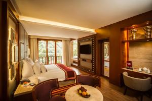 Cama ou camas em um quarto em Sumaq Machu Picchu Hotel
