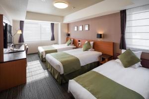 Postel nebo postele na pokoji v ubytování HOTEL MYSTAYS Kyoto Shijo