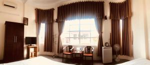 TV a/nebo společenská místnost v ubytování Nam Long Hotel