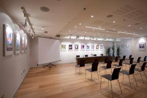 a conference room with a long table and chairs at Hotel Zinema7 in Donostia-San Sebastián