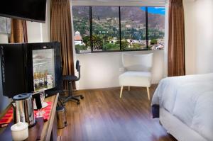 TV a/nebo společenská místnost v ubytování Hotel California Calca