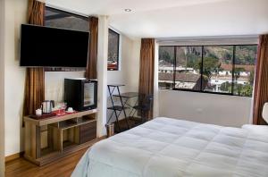 Postel nebo postele na pokoji v ubytování Hotel California Calca
