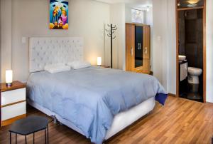 Postel nebo postele na pokoji v ubytování Hotel California Calca